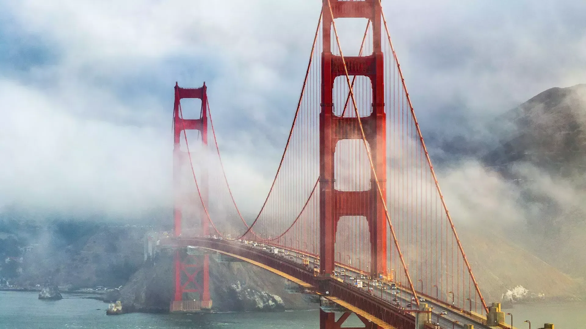 Golden Gate Bridge peaking out from behind the fog